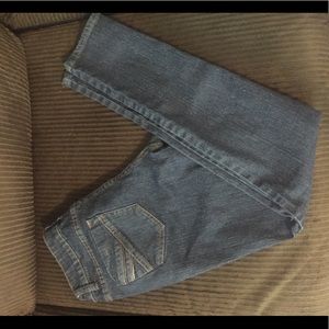 Lightly worn dark blue jeans